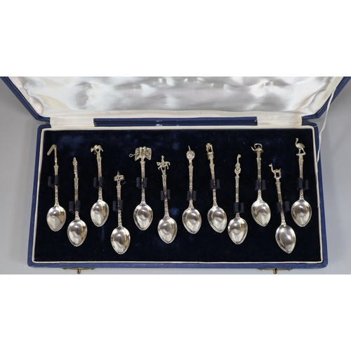 292 - Set of South American (Argentinian) silver coffee spoons with various symbolic terminals. Cased.  (1... 