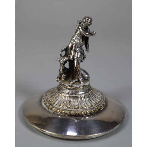 294 - An Elkington's Greek revival silverplated capstan shaped inkwell with figural cover, frieze of battl... 