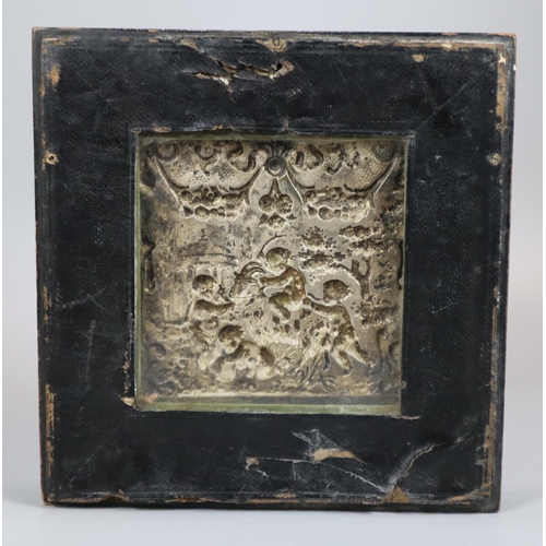 297 - Small silver repoussé panel decorated with cherubs playing on a goat, 18th century glazed double sid... 