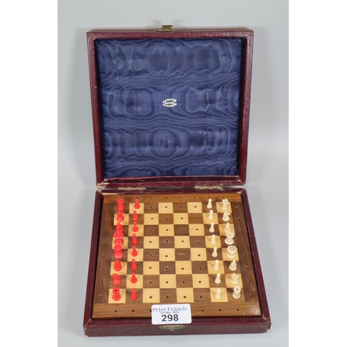 298 - Jaques of London travelling chess set, the pieces in red stained and ivory coloured plastic with a h... 