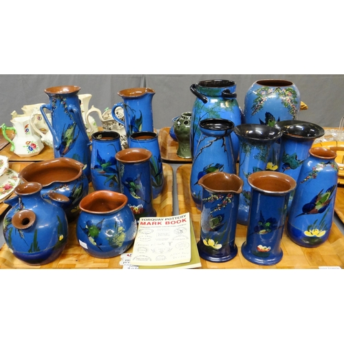 306 - Two trays of Torquay pottery blue ground kingfisher design items; vases, cylinder jugs, pots etc, va... 