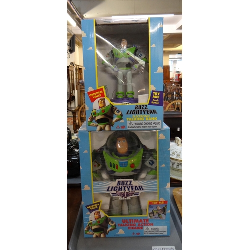 338 - Two Buzz Lightyear Toy Story figures in original boxes; a Buzz Lightyear electric talking bank and t... 