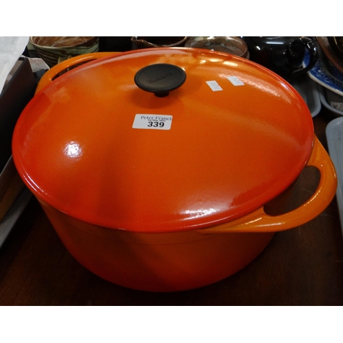 339 - Cast metal orange casserole dish by Cousances. 
(B.P. 21% + VAT)