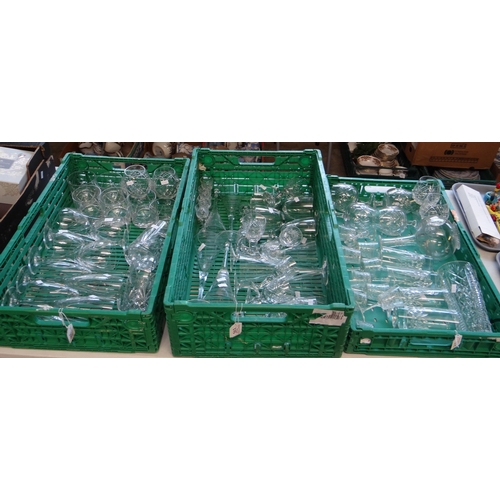 355 - Three crates of glassware to include: champagne flutes, wine glasses, whisky tumblers, brandy balloo... 