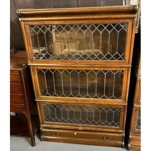 442 - Early 20th century oak Globe Wernicke style leaded and glazed three sectional bookcase with under dr... 