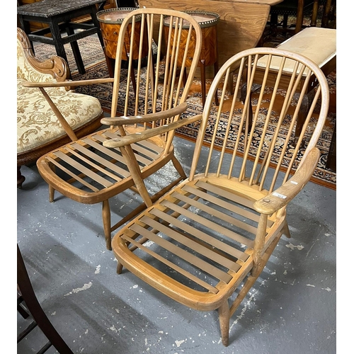 464 - Two similar elm and beech Ercol spindle back armchairs (missing their cushions).  (2)   (B.P. 21% + ... 