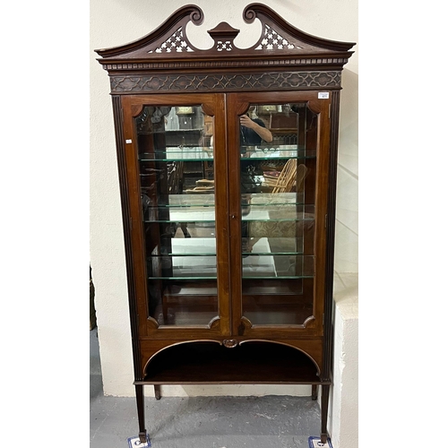 471 - Edwardian mahogany two door display cabinet, having brass swan neck pediment above fitted glass shel... 