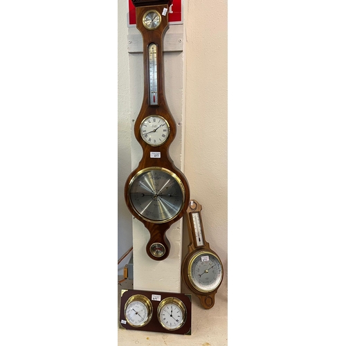 477 - Reproduction mahogany wheel barometer by Comitti of London together with a modern German clock and b... 