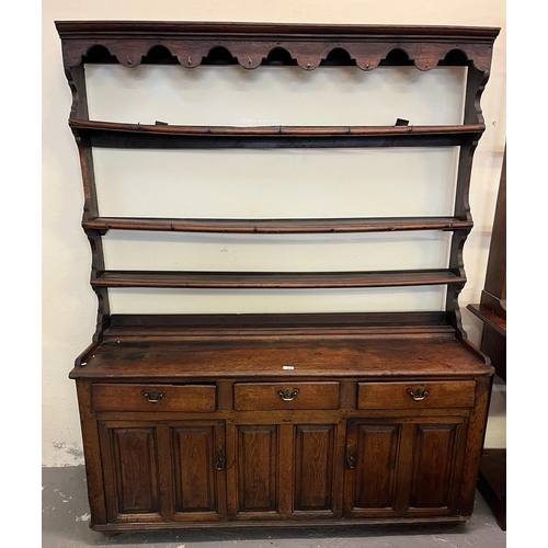 488 - Late 18th/early 19th century oak two stage dresser, the moulded cornice above open rack back, the pr... 