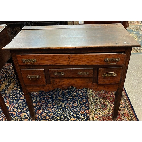 491 - Early 19th century oak lowboy, the moulded top above an arrangement of four drawers with shaped frie... 