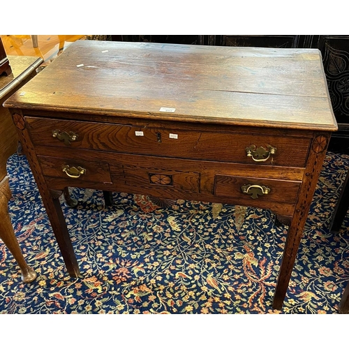 493 - Early 19th century oak lowboy, the moulded top above an arrangement on three drawers with fan decora... 