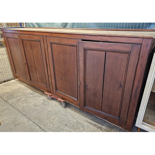 535 - (See Lot 525) Large early 20th century stained pine four door office/library cupboard with fitted in... 