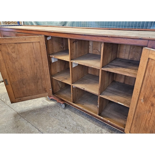 535 - (See Lot 525) Large early 20th century stained pine four door office/library cupboard with fitted in... 