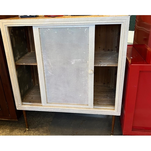 538 - Early 20th century meat safe on later tapering legs,  with mesh sliding doors and panels.  108x54x12... 