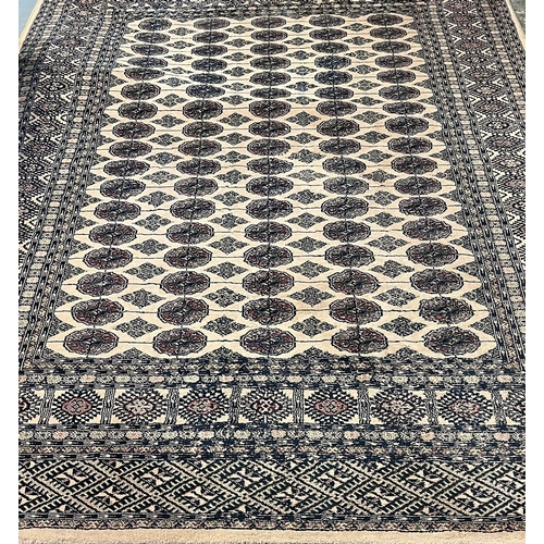 545 - Middle Eastern design, probably Pakistan, beige ground Bokhara rug.  160x227cm approx.   (B.P. 21% +... 