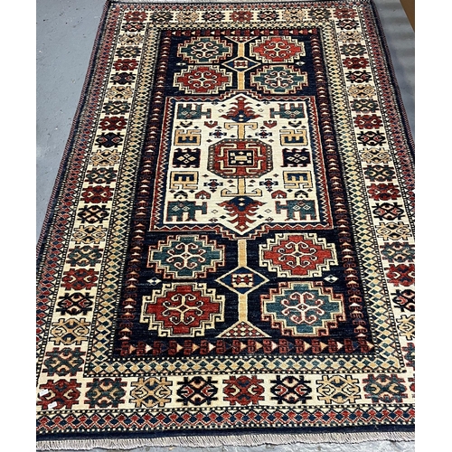 546 - Vintage Afghan tribal design multi-coloured rug.  190x120cm approx.   (B.P. 21% + VAT)