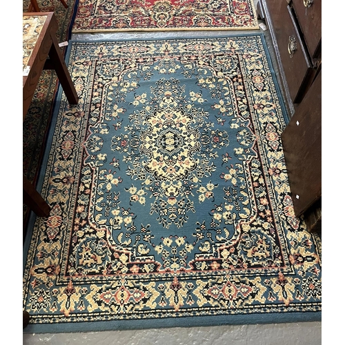 548 - 'Mister Magic' modern geometric design rug together with a Middle Eastern design red ground foliate ... 