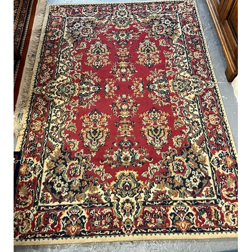 548 - 'Mister Magic' modern geometric design rug together with a Middle Eastern design red ground foliate ... 