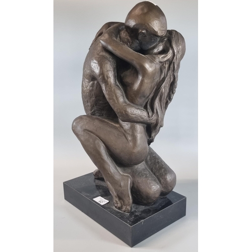 62 - Modern bronzed composition study of two nude figures in an embrace on rectangular base.  50cm high a... 