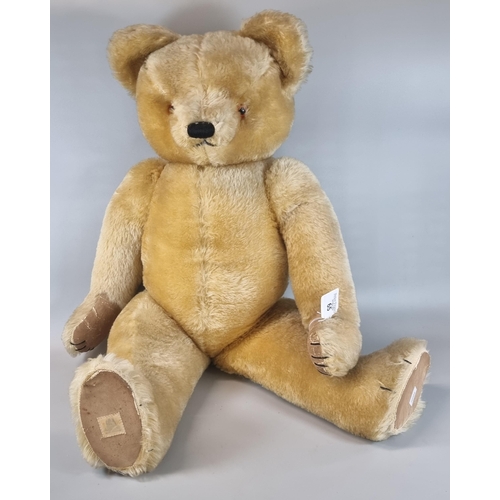 65 - 20th century growler teddy bear with stitched nose, moveable limbs and padded hands and feet.  The s... 