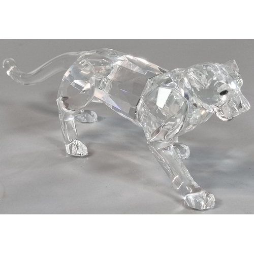 84A - Swarovski Crystal study of a striding female lioness in original tubular box.  (B.P. 21% + VAT)