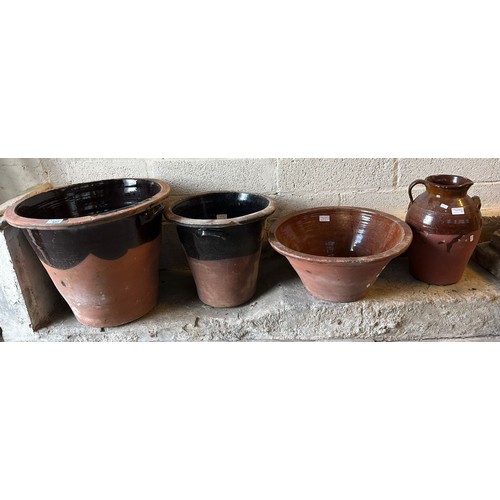 527 - Three terracotta dairy pans/pots together with a terracotta single handled baluster jug.  (4)  (B.P.... 