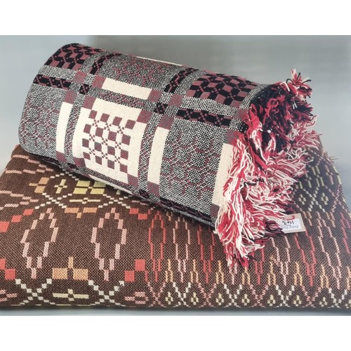 143 - Two vintage woollen Welsh tapestry blankets with geometric designs and fringed edges. (2)
(B.P. 21% ... 