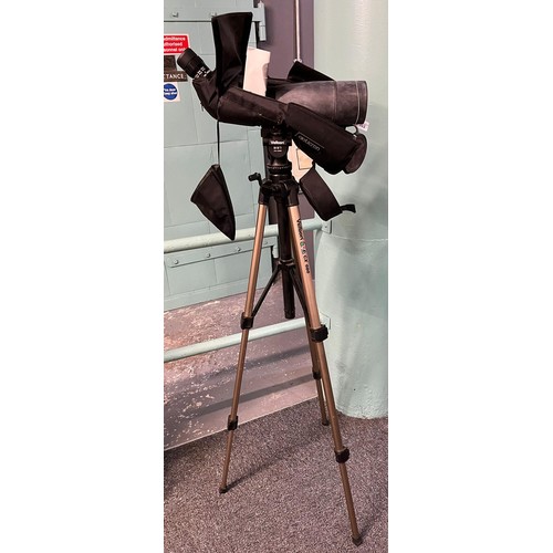 353 - Opticrones telescope with textile cover and folding tripod.   (B.P. 21% + VAT)