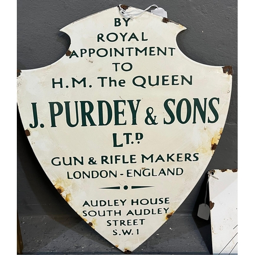 123 - Enamelled metal shield shape sign 'By Royal Appointment to H M the Queen, J Purdey & Sons Ltd. Gun a... 