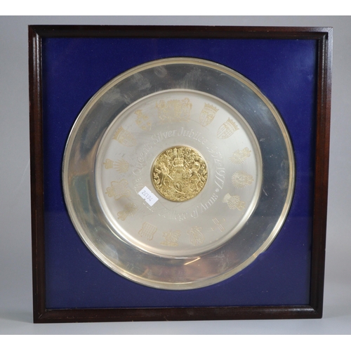 189 - Commemorative Elizabeth II silver circular dish with central raised gilt roundel and coat of arms, p... 