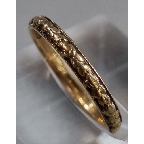 201 - 9ct gold wedding band with repeating wreath design.  1.8g approx. Size M.  (B.P. 21% + VAT)