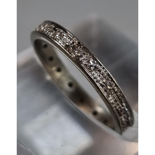 202 - White gold or platinum diamond full eternity ring. Unmarked.  2.21g approx. Size J1/2.  (B.P. 21% + ... 