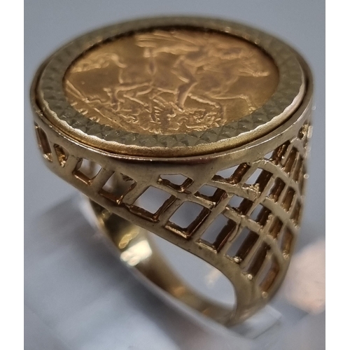 207 - 9ct gold pierced ring inset with a 1909 gold half sovereign.  8.1g approx.  Size Q.  (B.P. 21% + VAT... 