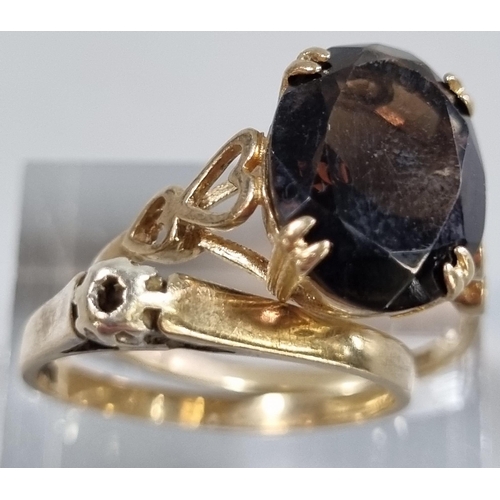 209 - Two 9ct gold dress rings, one missing a stone the other with probably smokey quartz stone.  4.2g app... 