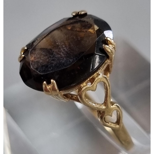 209 - Two 9ct gold dress rings, one missing a stone the other with probably smokey quartz stone.  4.2g app... 