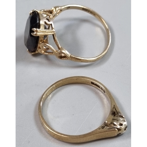 209 - Two 9ct gold dress rings, one missing a stone the other with probably smokey quartz stone.  4.2g app... 