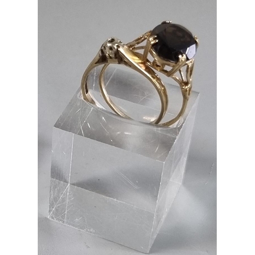 209 - Two 9ct gold dress rings, one missing a stone the other with probably smokey quartz stone.  4.2g app... 