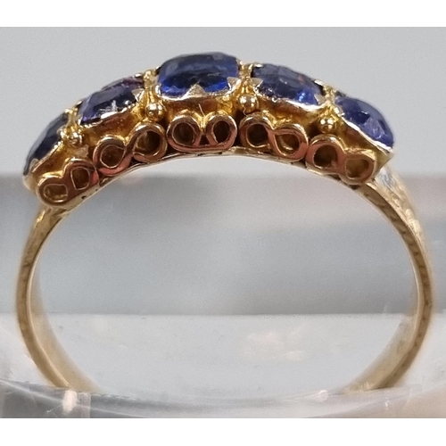 210 - 15ct gold Victorian ring set with five cornflower blue sapphires.  1.7g approx. Size L1/2.  In antiq... 