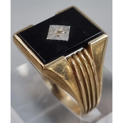 212 - 9ct gold black onyx signet ring with tiny diamond chip.  5.4g approx.  Size S.  (B.P. 21% + VAT)