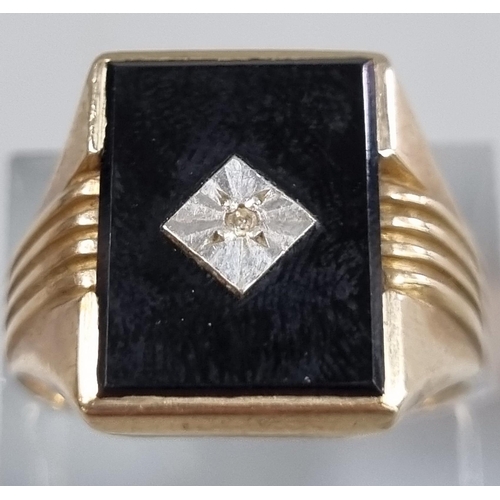 212 - 9ct gold black onyx signet ring with tiny diamond chip.  5.4g approx.  Size S.  (B.P. 21% + VAT)