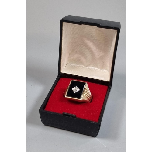 212 - 9ct gold black onyx signet ring with tiny diamond chip.  5.4g approx.  Size S.  (B.P. 21% + VAT)