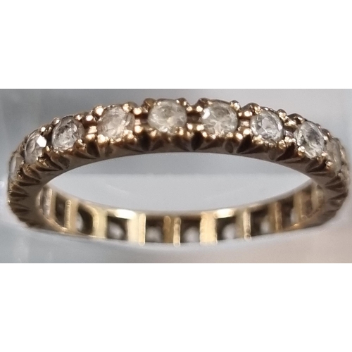 213 - 9ct gold full eternity style ring with white paste stones.  1.8g approx.  Size M1/2.  (B.P. 21% + VA... 