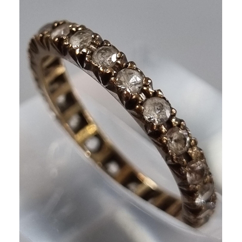 213 - 9ct gold full eternity style ring with white paste stones.  1.8g approx.  Size M1/2.  (B.P. 21% + VA... 