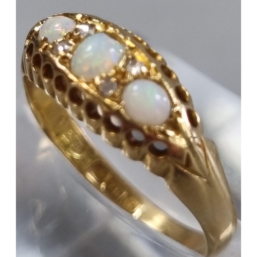 214 - Edwardian 18ct gold diamond and three stone Opal ring in fitted box.  2.8g approx.  Size O.  (B.P. 2... 