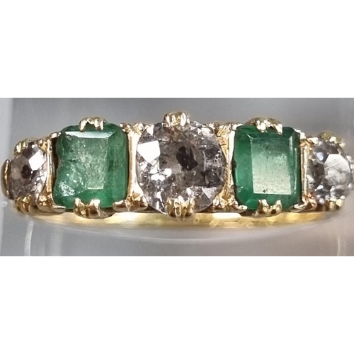 215 - Probably 18ct gold diamond and emerald five stone ring, set with old cut diamonds, the centre stone ... 