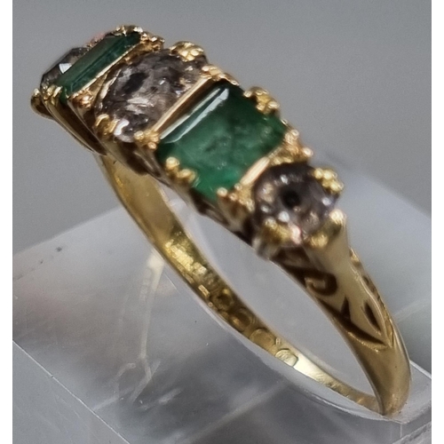 215 - Probably 18ct gold diamond and emerald five stone ring, set with old cut diamonds, the centre stone ... 