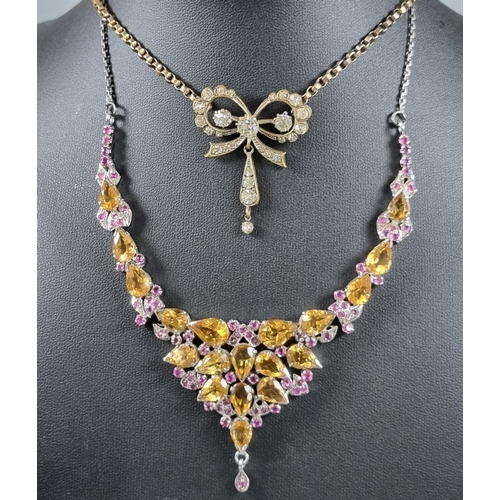 224 - Citrine and ruby set necklace in white metal together with a curb link chain with paste bow pendant.... 