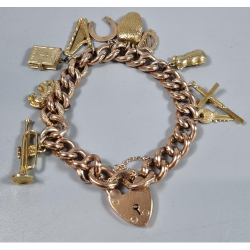 232 - 9ct gold curb link charm bracelet with assorted charms including: heart shaped padlock, harp, trumpe...