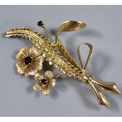 235 - 9ct gold floral and foliate brooch inset with rubies.  5.3g approx.  (B.P. 21% + VAT)