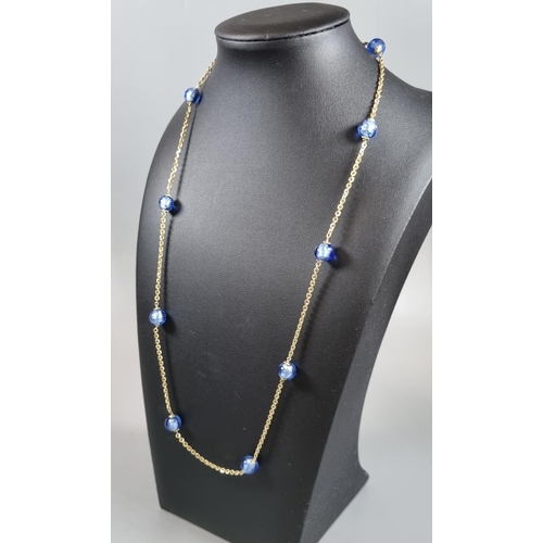 240 - 9ct gold chain with blue glass beads.  13.3g approx.  (B.P. 21% + VAT)